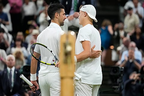 Novak Djokovic is congratulated by Holger Rune